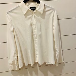 Sharp and classic white cotton shirt with with fun pleated details on the back.